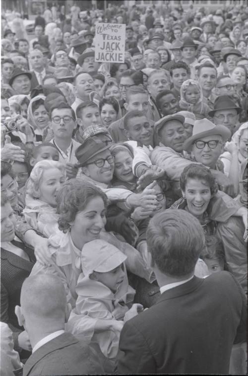 Image of President Kennedy greeting the crowd in front of the Hotel Texas