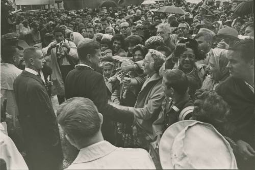 Image of President Kennedy greeting the crowd in front of the Hotel Texas