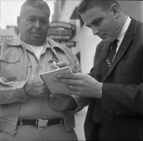 Reporter Hugh Aynesworth interviewing cab driver William Whaley