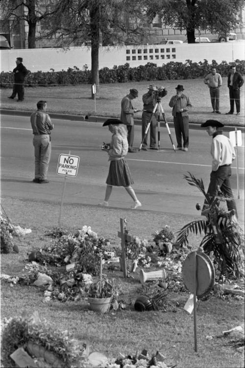 Secret Service taking measurements in Dealey Plaza on November 27, 1963