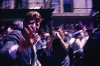 Image of John F. Kennedy waving to parade crowds in Dallas in 1960