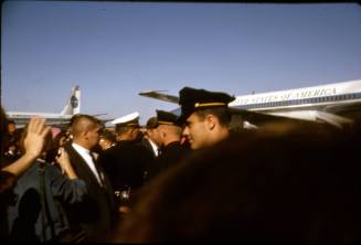 Image of the Kennedys amidst a crowd at Love Field