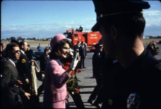Image of Jacqueline Kennedy waving to the crowds at Love Field