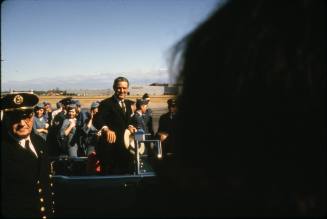 Image of Governor John Connally getting into the limousine at Love Field