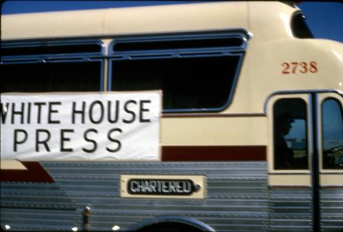Image of a White House Press bus at Dallas Love Field