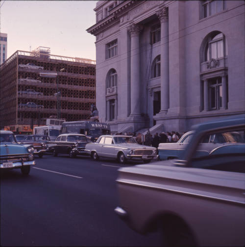 Color image of press outside Dallas City Hall after the assassination