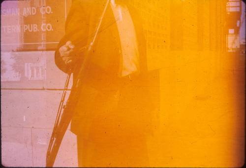 Image of police officer holding the rifle found in the Book Depository