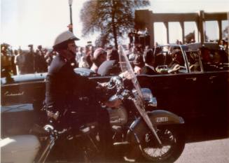Image of President Kennedy's limousine in Dealey Plaza