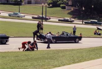 Photograph of replica presidential limousine during filming of "JFK"