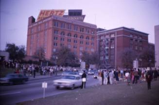 Image of crowds gathered in Dealey Plaza after the assassination