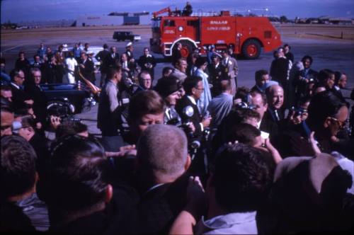 Image of President Kennedy greeting the crowd at Love Field
