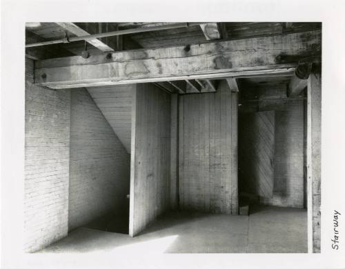 Black and white photograph of the NW staircase on the sixth floor of the TSBD