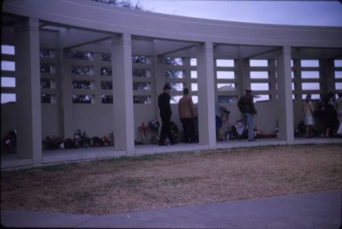 Image of floral tributes left at Dealey Plaza