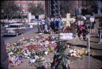 Image of flower arrangements in Dealey Plaza after the assassination
