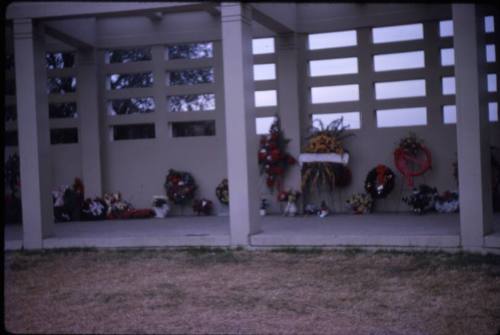 Image of floral tributes left at Dealey Plaza