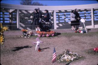 Image of floral tributes left at Dealey Plaza