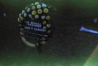 Image of floral tribute in Dealey Plaza after the assassination, Slide #14