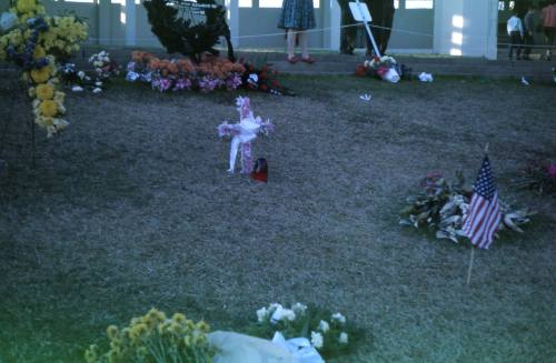 Image of floral tributes in Dealey Plaza after the assassination, Slide #15