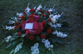 Image of a floral tribute in Dealey Plaza after the assassination, Slide #24